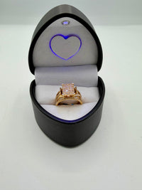 14k yellow gold ring with baguette and round-cut diamonds.