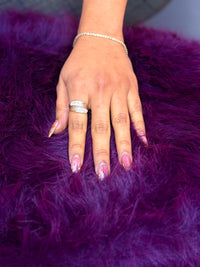 14k This is a yellow gold ring with marquise-cut (Cz) stones  in a wide band design.