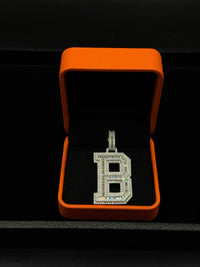 Silver with moissanite initial pendant
