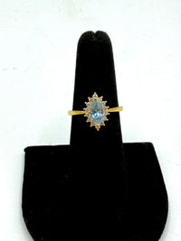 14k This is a vintage-style pear-shaped aquamarine and diamond halo ring with Cz diamonds
