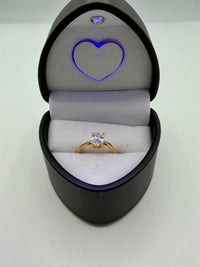 14k oval-cut solitaire engagement ring in a yellow gold setting With CZ diamond