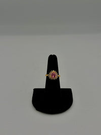 14K Gold heart-shaped gold ring with a pink gemstone center and a white stone halo setting with CZ diamonds
