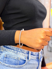 This is a David Yurman cable cuff bracelet, likely in sterling silver, featuring a twisted rope design with domed end caps.